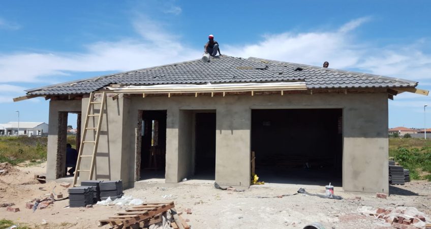 Front image of manufacturing of roof tiling for housing.