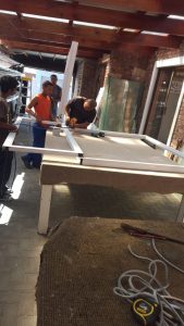 Employees working on wood framing.